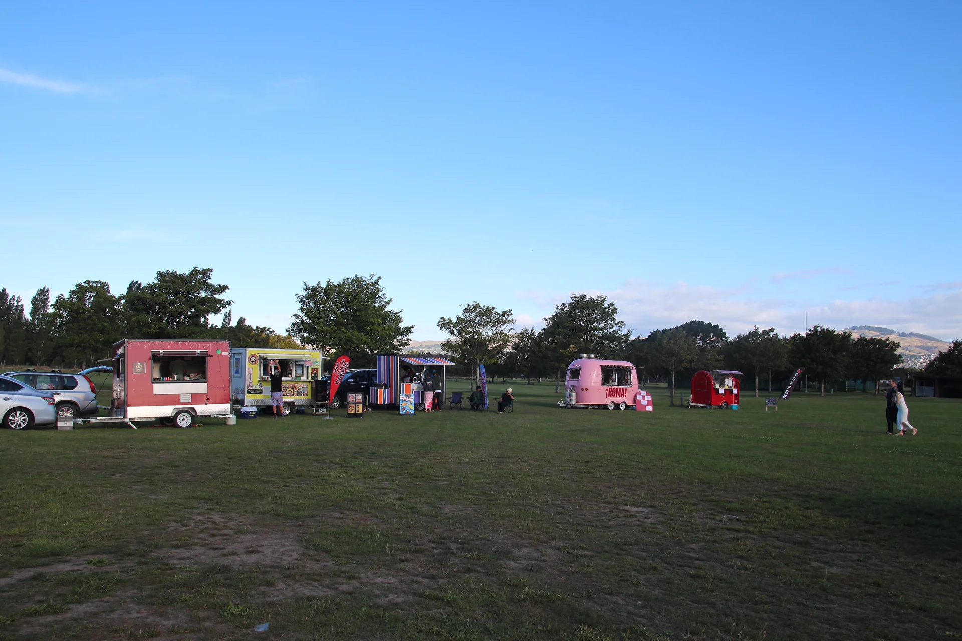 Food truck village and mobile beverage vendors trading on the park lawn at Firefly Cinemas Christchurch